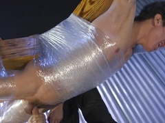 Wrapped in foil and granted extreme handjob, this male slave begs for anal