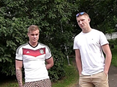 Two kinky footy fans fuck around in a threesome