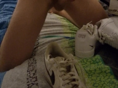Young teenager masturbates off his dick and splashes on the sneaker