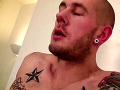 Dude with shaved head is on his knees deepthroating rock-hard lollipop