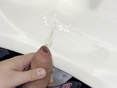 Slimy big uncut dick pissing and cumming in publicl toilet
