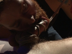 Dazed smile from a top who sniff his bottom's horny crotch