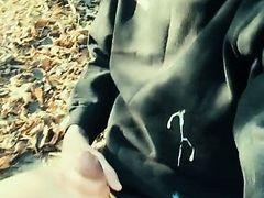 Huge cumshot on black shirt in the park