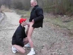 Parent And Junior Man Poking Outdoors