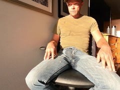 Soaking denim in front of a motel window