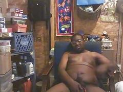 Plump black guy wanking his rod