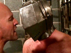 Putting a helmet on his head and using his body and cock