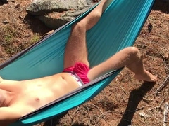 Canadian fellow faps his uncircumcised sausage in a hammock on a super hot and sunny day