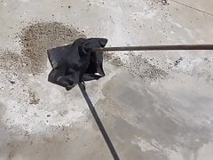 sweeping floor outdoors with black skirt 4