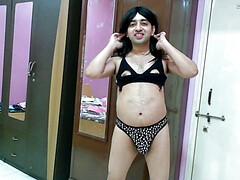 Hot crossdresser in animal print thong and black bra getting naked.