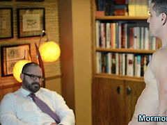 Bishop anoints with jism